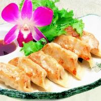 Gyoza · Pan fried pork dumplings with special sauce.