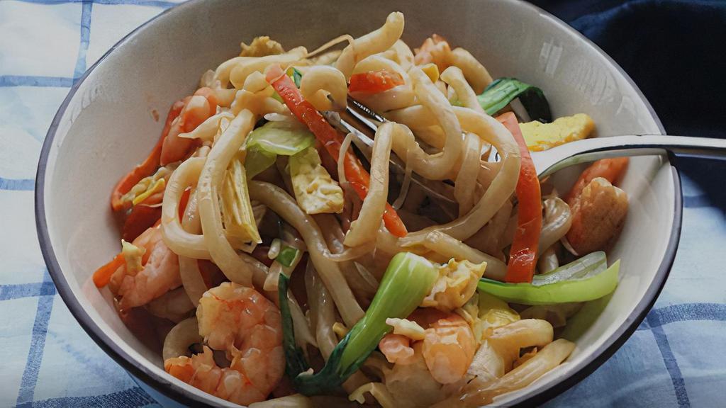 Seafood Yaki Udon · Japanese noodle stir fried with scallop, shrimp, crab stick, fish cake, and vegetable.