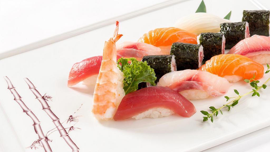 Sushi Deluxe (9 Pieces) · Assorted fresh fish sushi with one tuna roll.