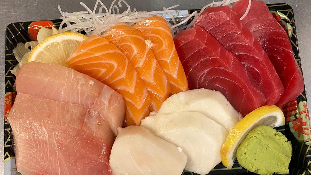 Sashimi Combination · Three pieces of fresh tuna, three pieces salmon, three pieces yellow tail three pieces white tuna sashimi.