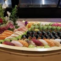 Love Boat · 24 pieces of assorted fresh sashimi and 10 pieces of assorted sushi with rainbow, Manhattan,...
