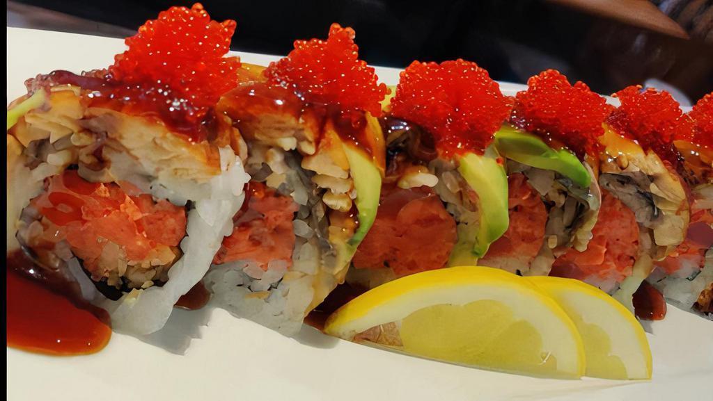 Spicy Dragon (8 Pieces) · Spicy tuna mixed with tempura crunch topped with broiled eel avocado tobiko and eel sauce.