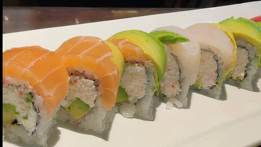 Rainbow · Eight pieces crab stick avocado and cucumber wrapped in seaweed, topped with tuna, salmon, red snapper, and avocado.
