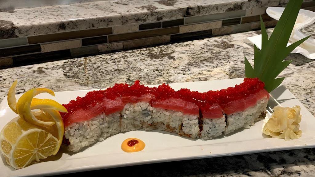 Fire Dragon (12 Pieces) · Spicy tuna, salmon, eel, snow crab, and tempura crunch, topped with fresh tuna tobiko and chili sauce.