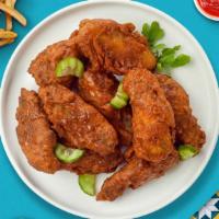 Hot Ville Wings  · Fresh chicken wings breaded, fried until golden brown, and tossed in nashville hot sauce. Se...