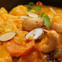 Korma · creamy yellow curry. flavorful spices and coconut