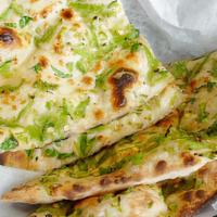 Bullet Naan · naan cooked with thinly chopped onions, chillies and cilatro