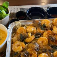 Butter Garlic Shrimps Over Rice · Our homemade butter garlic sauce marinated shrimps overnight, wok on fires with a savory tas...