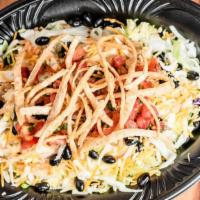 Chicken Fiesta Salad · Shredded lettuce and cabbage with seasoned rice, cheddar and pepper jack cheese, black beans...