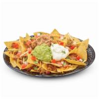 Original Nachos · Fresh corn tortilla chips smothered with refried pinto beans, cheddar and pepper jack cheese...