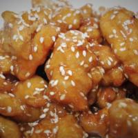 Sesame Chicken · Deep fried chicken tender, toasted in a honey glazed sauce with sesame seeds.