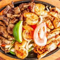 Trio Fajitas For 1 · Marinated in our own seasoning and served sizzling with grilled onion, red and green peppers...