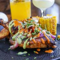 Roasted Peruvian Chicken* · Corn, sweet potatoes, salsa criolla, cilantro, lime.
