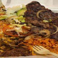 El Mariachi Special Plate · thin steak with grilled onions and tomatoes, chile relleno and red enchilada
