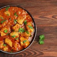 Chicken Karahi · Chopped chicken blended with our special spices and prepared in home style karahi sauce.