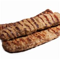 Lamb Seekh Kabab · Minced lamb mixed with onion and herbs, roasted on skewers.