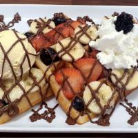 Crepella Waffle · 2 Large waffles, honey, banana, strawberry, blueberry, blackberry, nutella  & ice cream.
Whi...