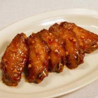 Hong Kong Wings - Spicy Sauce (10 Pcs) · Crispy wings covered in mouth-watering sweet & spicy sauce