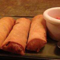 Crispy Spring Rolls · Deep-fried chopped vegetables rolled in a wheat wrapper and Served with sweet chili sauce.