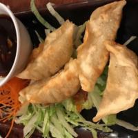 Pot Stickers · Deep-fried dumpling filled with pork and vegetable served with house special soy sauce. 6 pi...