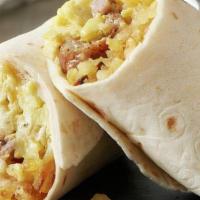 Breakfast Burrito · Handheld burrito filled with home fried potatoes, two scrambled eggs and pork green chile.