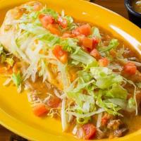 Pregnant Donkey Burrito · Stuffed with a crispy chile relleno, beans, and rice. Topped with cheese, green chile, lettu...