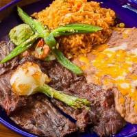 Carne Asada · Tender skirt steak flame broiled to your liking served with a fried jalapeno tornado, grille...
