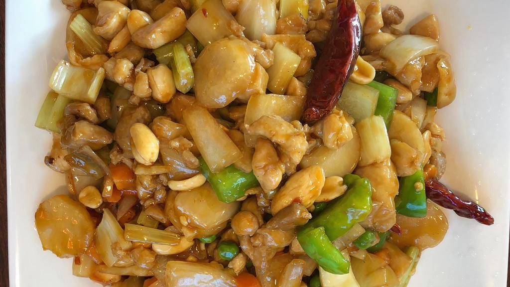 Kung Pao Chicken · Hot and spicy. Chicken stir-fried with fresh onions, green peppers, carrots, water chestnuts, and peanuts in spicy sauce.