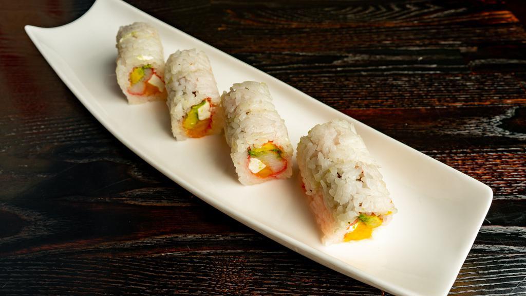 Sunny · Crab, avocado, mango, cream cheese rolled in soy paper with ginger sauce.