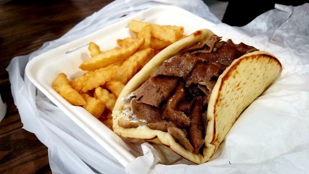 Gyros Pita · Most popular. Thinly sliced layers of seasoned beef and lamb broiled on a vertical skewer with onions, tomatoes, and tzatziki sauce.