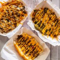 Big Bros Cheese Fries · Our signature fries topped with our chili oil cheese sauce
