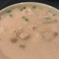 Tom Kah Gai (Chicken Coconut Soup) · Tender bite-sized chicken, straw mushrooms, coconut milk, lemongrass and lime leaves unite t...