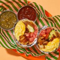 Millennial Avocado Breakfast Burrito · Two scrambled eggs with bacon, crispy potatoes, melted cheese, avocado, tomato, and carameli...