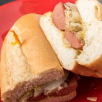 Pastrami Dog · 1/4 lb all beef hot dog with pastrami, Swiss, pickle spear, and spicy mustard.