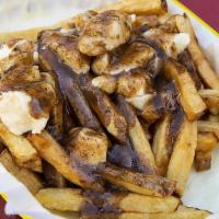 Poutine · Our take on the classic Canadian comfort food - fresh cut fries topped with TMK Creamery che...