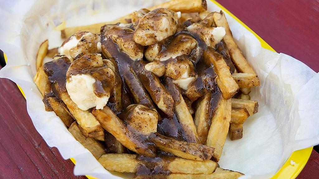 Poutine · Our take on the classic Canadian comfort food - fresh cut fries topped with TMK Creamery cheese curds & our homemade beef gravy.  Vegetarian and Vegan versions also available.