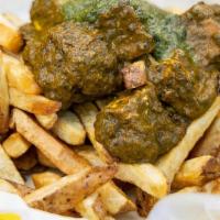 Palak Paneer Fries · Fries topped with curried spinach and paneer cheese, served with cilantro chutney.