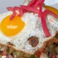 Chicken Tinga Chilaquiles · Salsa Verde, refried beans,  pico de gallo, queso fresco, Fried eggs