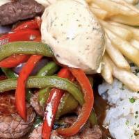 Lomo Saltado · Tenderloin Steak, Sauteed Onions, Tomatoes, Bells Peppers, Aji Amarillo Cream, Sushi Rice, B...