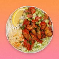 Chicken Kebab Rice Bowl · Grilled chicken over white rice with hummus, diced cucumber and tomato salad, shredded green...