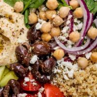 Combo Hummus Bowl · Your choice of two proteins over hummus, diced cucumber and tomato salad, shredded green cab...