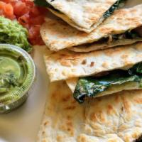 Epazote Mushrooms Quesadillas · Spicy. Sauteed mushrooms with white wine, epazote Mexican spice, onion melted jack and shred...