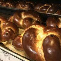 Sweet Raisin Bread · A Brioche and Challah inspired sweet dough with scattered raisins, hand braided and egg washed