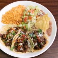 3 Soft Tacos W/Rice And Beans Plate · 3 soft tacos with onions, cilantro and salsa. Plate includes rice, beans, lettuce, tomato, s...