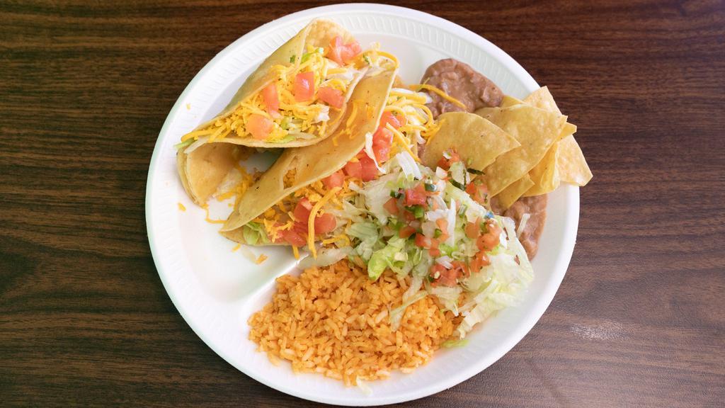 2 Chicken Hard Shell Tacos Plate · 2 hard shell chicken or shredded beef tacos. Plate includes rice, bean, lettuce, tomato and sour cream.