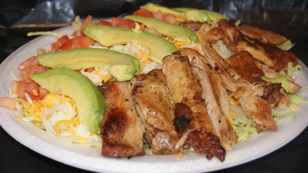 Chicken Salad · Grilled chicken salad. Includes lettuce, tomato, avocado & cheese