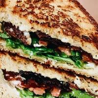 Blt · bacon, lettuce & tomato with a touch of mayo on thick-cut toasted sourdough bread