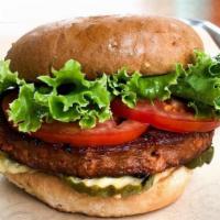 Vegan Burger · plant based patty, crispy onions, sliced pickles, HAP sauce, organic lettuce & tomato on a t...