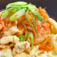 K-Mac · Kimchi, cheddar cheese sauce, scallions, crispy onions, and gochugaru.