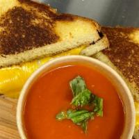 Grilled Cheese And Tomato Soup · cheddar / fontina / smoked gouda / hearty tomato soup